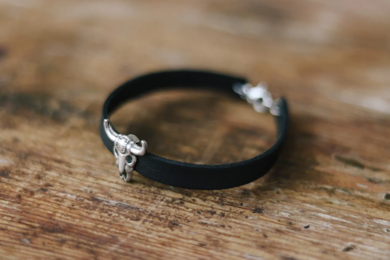 Bull skull bracelet for men with a black faux leather cuff strap, custom size, festival jewelry