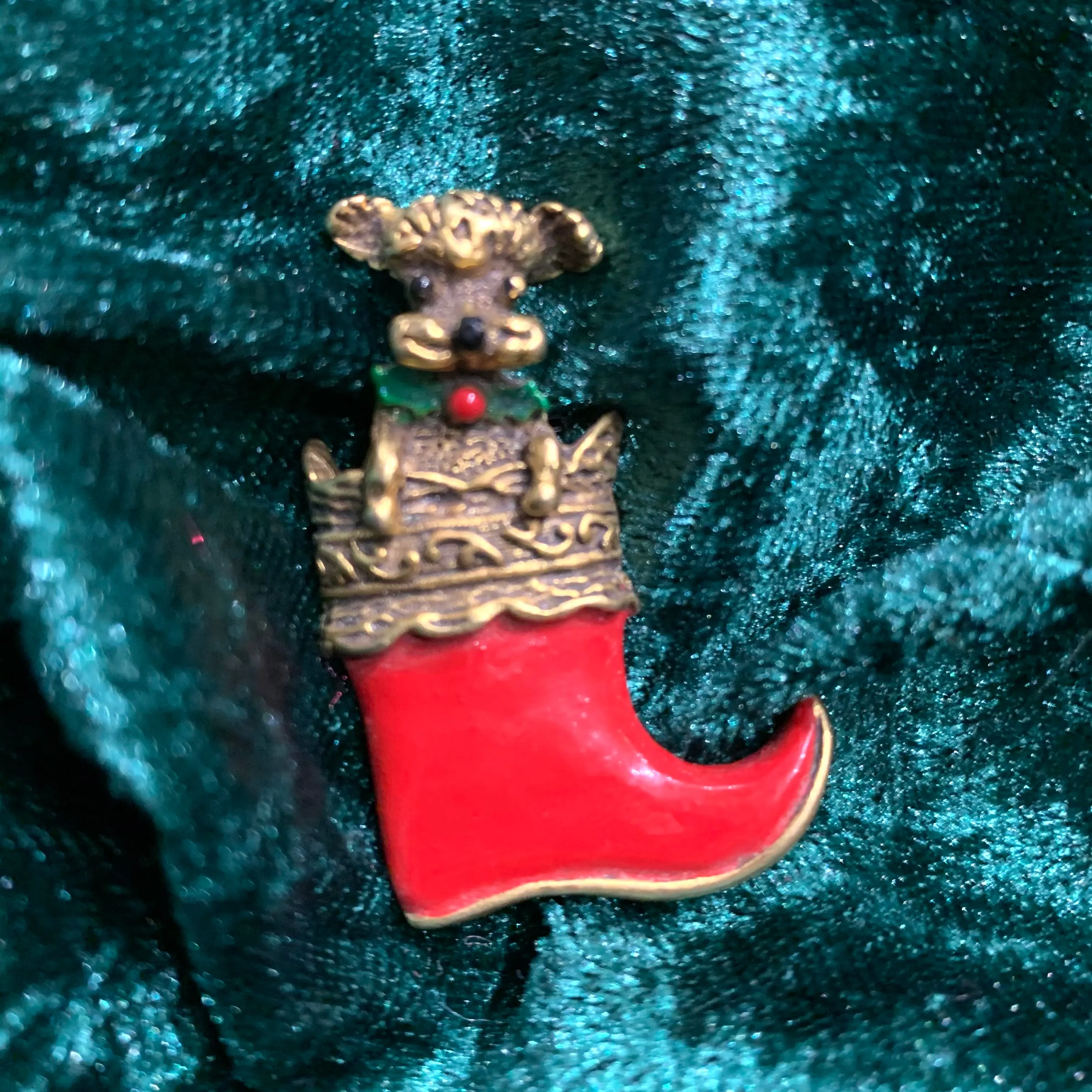 Dog in a stocking Christmas brooch by Butler and Wilson